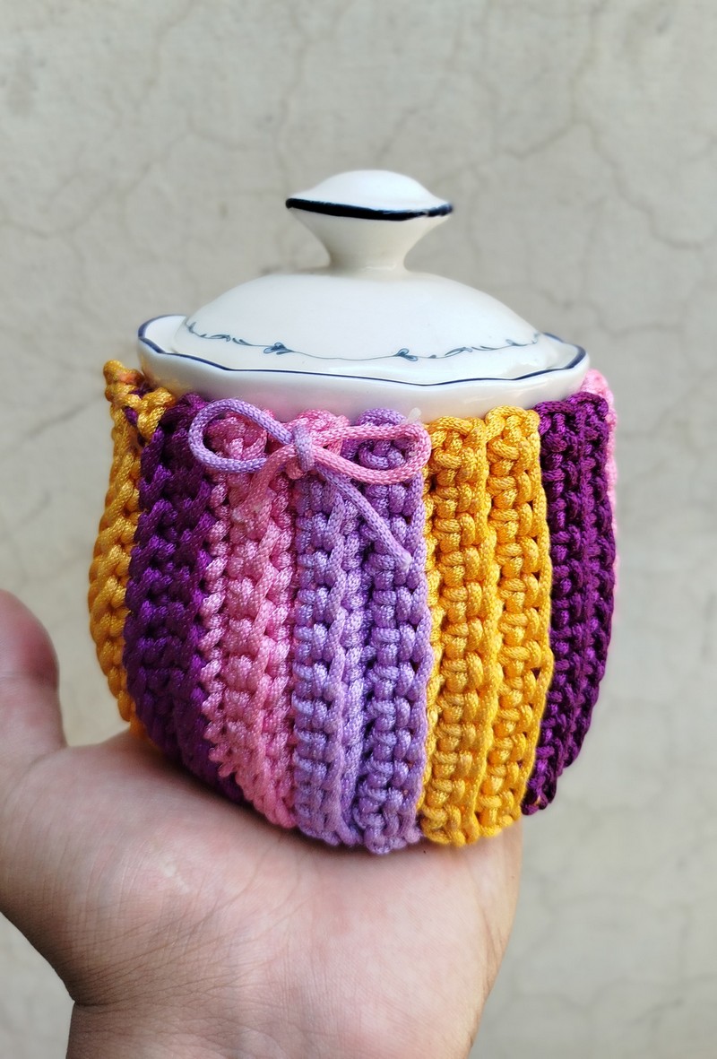 Colorful crochet Candy Burst mug cozy pattern