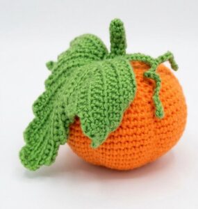 Free Crochet Pumpkin Amigurumi with a Life-Like Leaf Pattern for Fall